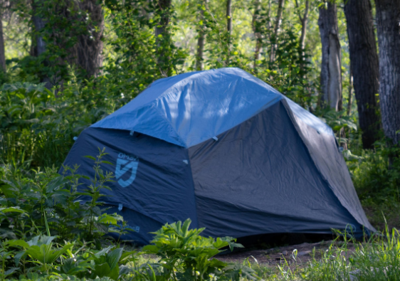 Tent in rural area depicting rural homelessness