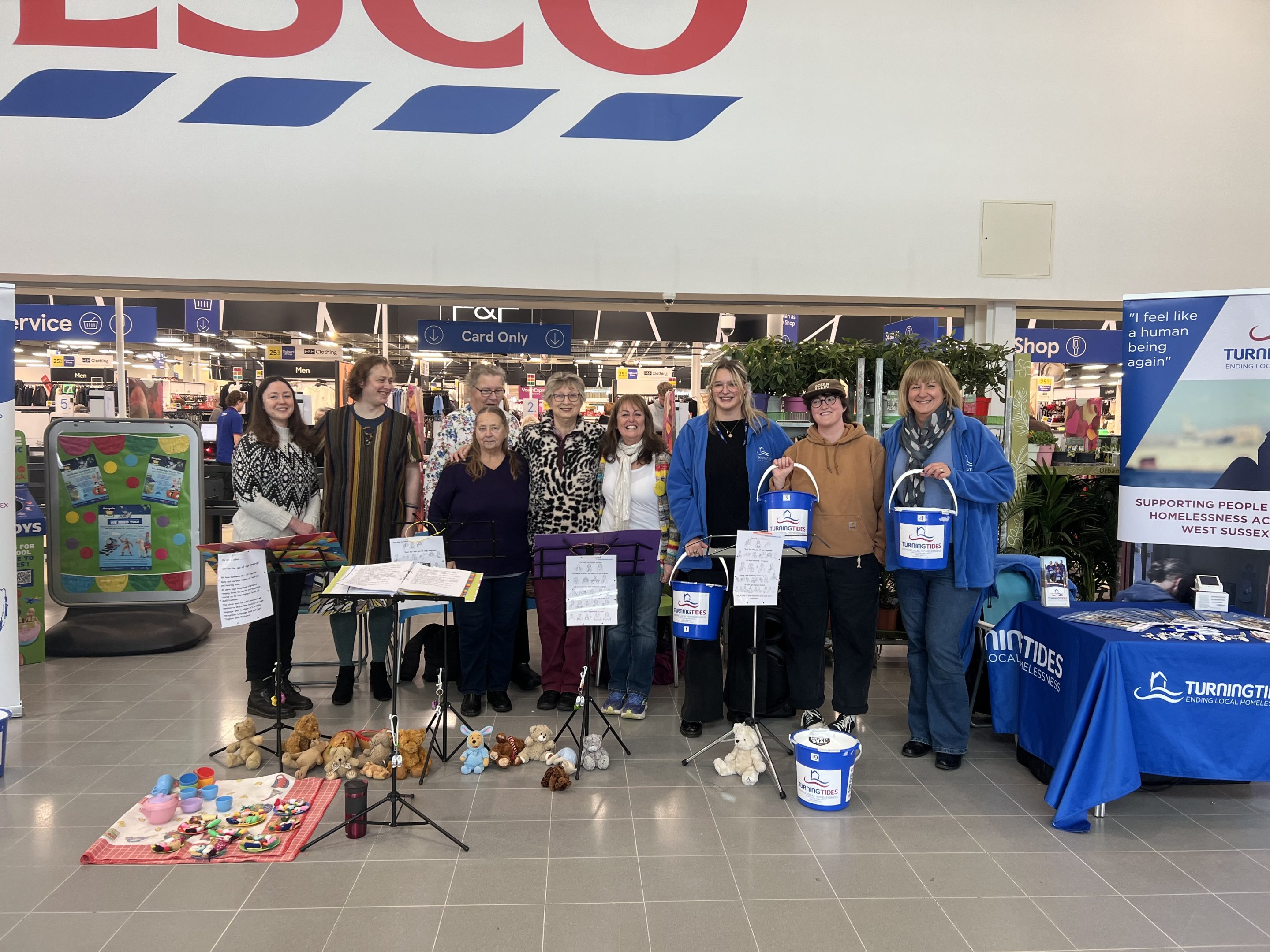 Picture of Just for the Joy of Sign Lanuage choir bucket collection at Tesco.
